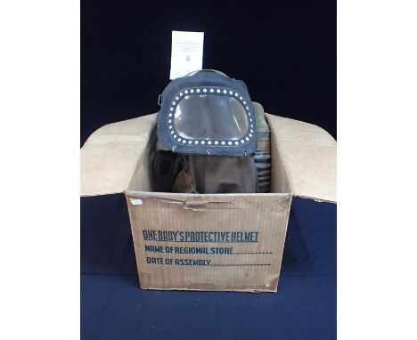 A WWII BABY'S PROTECTIVE HELMET (GAS MASK) in original cardboard box, with leaflet, 1939 issue