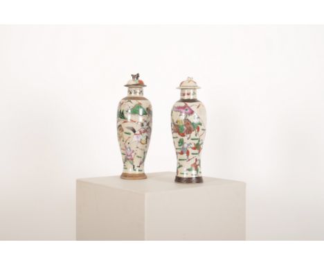 TWO CHINESE FAMILLE VERTE CRACKLEWARE PORCELAIN BALUSTER SHAPED VASES early 20th Century, decorated with warriors, with possi
