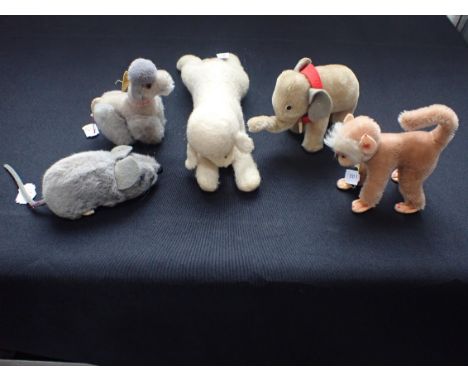A GROUP OF STUFFED ANIMALS including three by Steiff