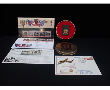 A ZIPPO D-DAY 50TH ANNIVERSARY LIGHTER in tin, together with two D Day first day covers and a 1974 Avro Lancaster 30th Annive