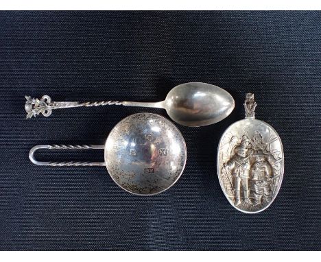 ROBERT WELCH: A SILVER CADDY SPOON with twisted loop handle and circular bowl, London 1980, another silver spoon, and an impo