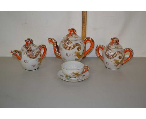 A Japanese porcelain tea service with serpent decoration