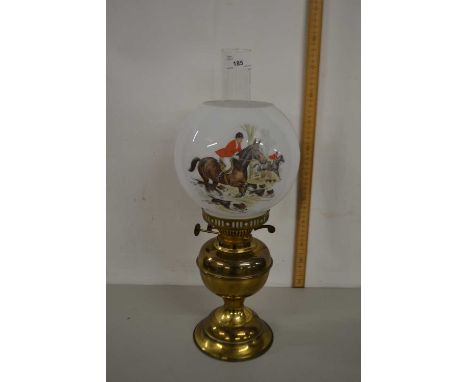 Brass based oil lamp with shade decorated with a hunting scene