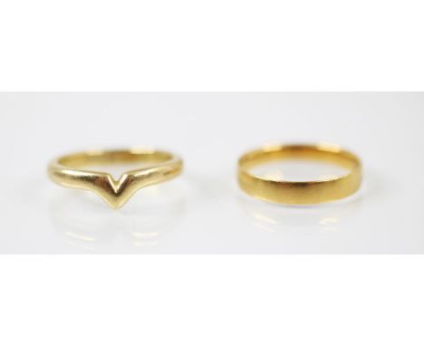 A 22ct yellow gold wedding band, stamped London 1881, ring size L ½, 2.2gms, with a further 18ct yellow gold shaped wedding b