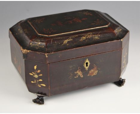 A Chinese lacquered tea caddy, 19th century, of sarcophagus form with hinged cover opening to reveal a divided pewter lined i