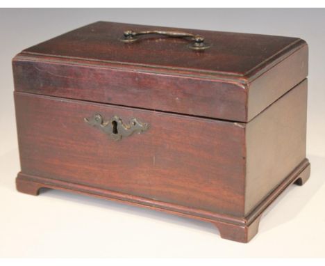 A George III mahogany tea caddy, of rectangular form with lip moulded hinged cover, opening to a vacant interior, upon bracke