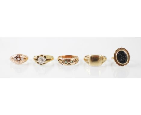 A collection of rings, including a yellow metal, possibly 18ct yellow gold, gypsy ring with paste set stone, ring size N, a 9