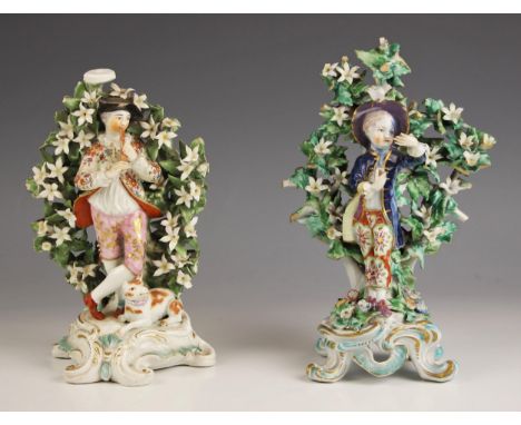 A near pair of English porcelain figures, 18th century, one modelled as a young gentleman in classical dress, marked in red t