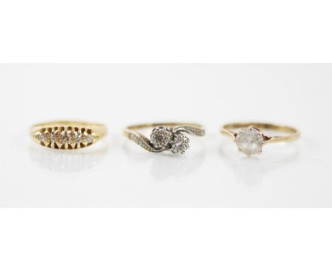 A 18ct yellow gold and diamond ring, the five mixed cut diamonds within an openwork yellow gold mount, leading to plain polis
