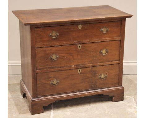 A 19th century oak chest of drawers, the associated oversailing rectangular top above three long graduated drawers, applied w