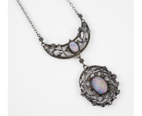 An early 20th century William H Haseler white metal and opal doublet necklace, the openwork swag pendant with oval opal doubl