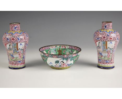 A pair of Chinese enamel vases, Canton (19th century), each high shouldered baluster vase decorated against a pink ground wit