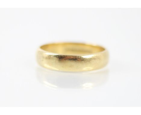 An 18ct yellow gold wedding band, stamped 'CG&amp;S' Sheffield 1984, ring size U, 6.3gms 