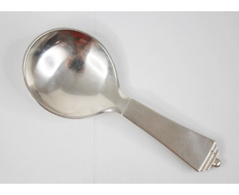 A Georg Jensen sterling caddy spoon, the plain polished caddy spoon in the pyramid pattern (1933-1944) stamped to reverse wit