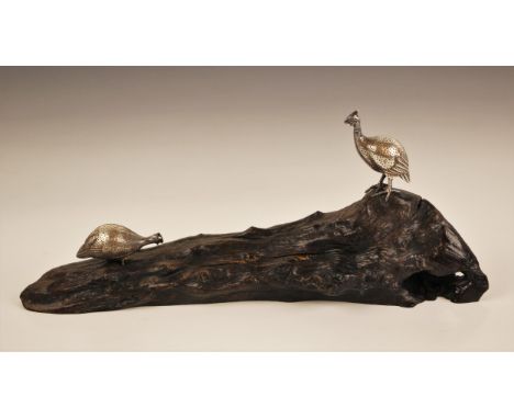 A Patrick Mavros (Zimbabwean, 21st century) silver model of two guinea fowl upon a wooden base, initialled circular ‘PM’ to b