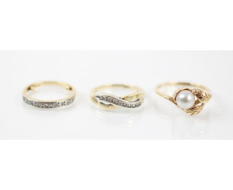 A diamond yellow metal half eternity ring, the nine round cut diamonds within a white metal topped head with yellow metal pla