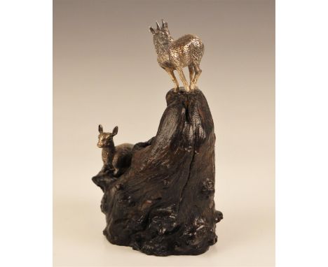 A Patrick Mavros (Zimbabwean, 21st century) silver model of two Klipspringer upon a wooden outcrop, initialled circular ‘PM’ 