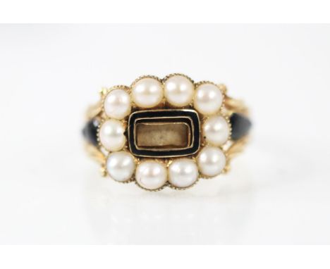 A George IV split pearl and enamel mourning ring, the central rectangular aperture within black enamel surround and further s