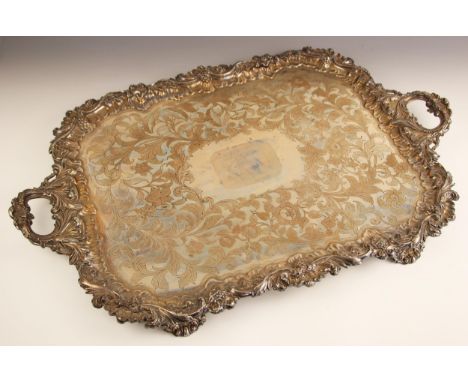 A large silver plated rectangular tray, the cast scrolling ivy leaf detailed rim with twin conforming handles, above floral a