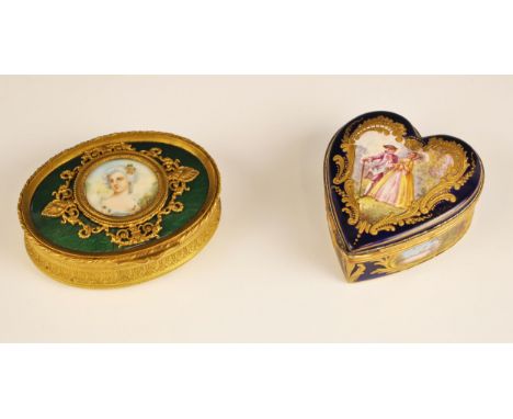 A porcelain enamel Sevres style trinket box, 20th century, of heart shaped form, with a central scene of a courting couple an