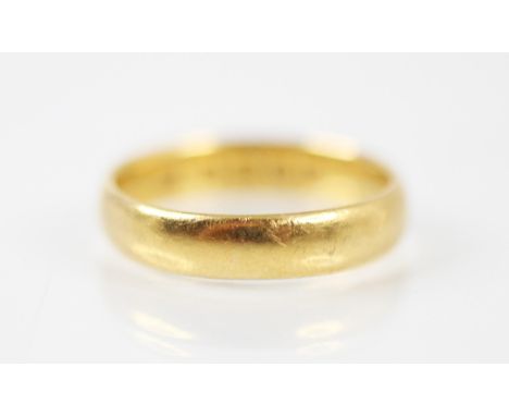 A 22ct yellow gold wedding band, stamped 'SB' Birmingham 1912, ring size M, 4.3gms 