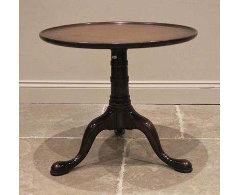 A George III style mahogany tray top tripod table, the circular top with a raised moulded rim, upon a ring turned tapering co