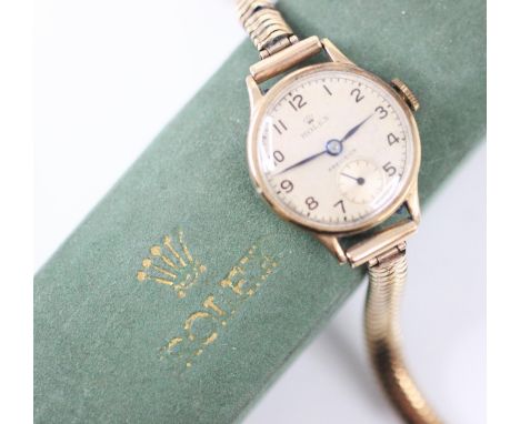 A ladies 9ct yellow gold Rolex Precision wristwatch, the circular cream dial with Arabic numerals with subsidiary dial, with 