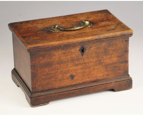 A George III mahogany tea caddy, the top with a brass swing handle opening to later interior fitted as a miniature blanket ch