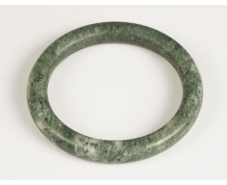 A Chinese polished Jade bangle, of plain polished spherical form, 7.5cm wide overall 