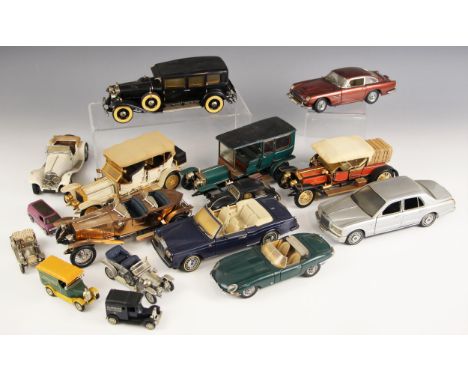 A collection of Franklin Mint 1/24 scale die cast model cars, to include; a Rolls Royce Silver Seraph, a 1964 Aston Martin DB