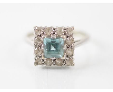 A untested zircon and diamond square cluster ring, the central zircon within a surround of twelve diamonds, all set within a 
