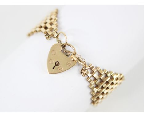 A 9ct yellow gold gate link bracelet, the bracelet of wide gate link form, with link indistinctly stamped for 9ct yellow gold