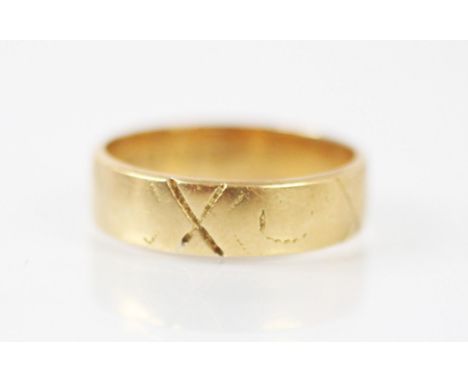 An 18ct yellow gold wedding band, with rubbed engraved detail, stamped London 1893, ring size L, 3.8gms 