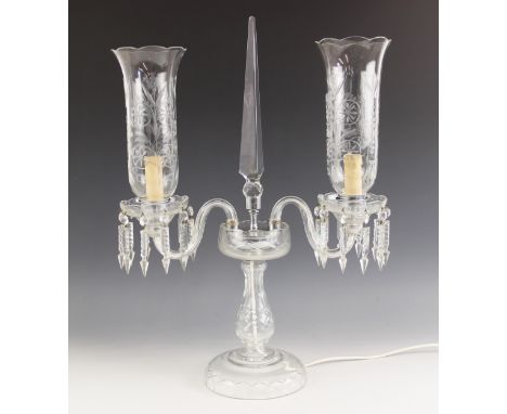 A twin branch glass table lamp, 20th century, modelled as a Victorian style candelabra, the central obelisk flanked by tall s