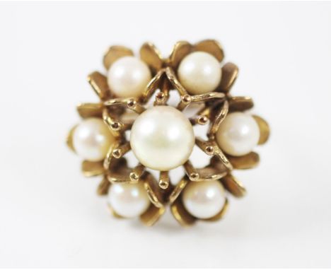 A 9ct yellow gold and untested pearl dress ring, designed as a flowerhead with multiple petals, set with seven untested pearl