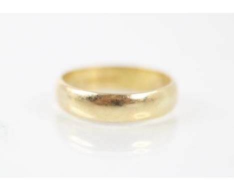 An 18ct yellow gold wedding band, stamped 'CG&amp;S' Birmingham 1985, ring size O, 4.3gms 