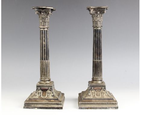 A pair of Victorian silver candlesticks, Mappin Bros Sheffield 1898, of traditional Corinthian column form, with acanthus cap