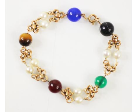 A late 20th century multi stone bracelet, the yellow metal trefoil designed spaces with five spherical polished beads includi