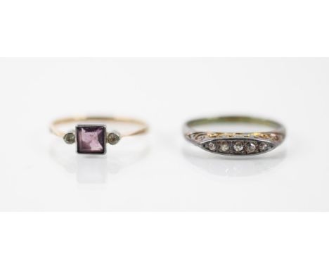 A yellow metal diamond ring, the five graduated mixed cut diamonds within scroll work mount leading to plain polished shank, 