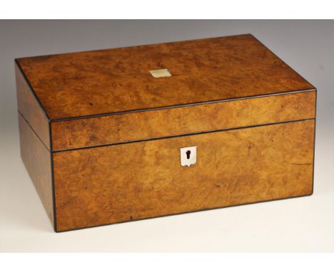 A Victorian figured walnut stationery box, inset with a mother of pearl cartouche and escutcheon, outlined with ebonised stri