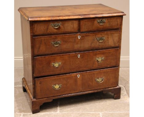 A William and Mary walnut chest of drawers, early 18th century, the rectangular moulded top over two short and three long cro