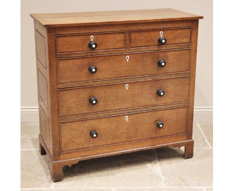 An oak chest of drawers, possibly Welsh, late 18th/early 19th century, formed with two short over three long graduated, cross