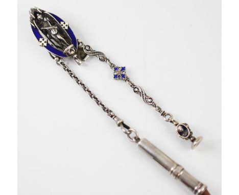 An early 20th century enamel and white metal chatelaine, the oval clip with blue enamel border and central cast figure of a w