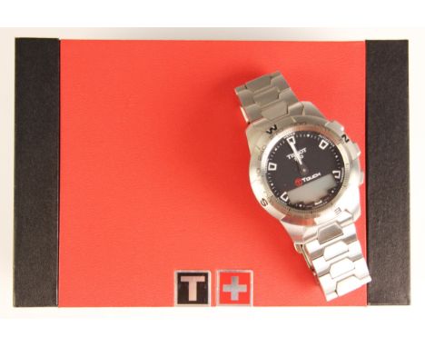 A gentlemans Tissot T touch wrist watch, the circular dial with baton markers and digital screen, upon an integral brick link