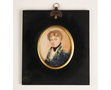 English school (early 19th century),An oval portrait miniature depicting a young gentleman in a blue frock coat,Watercolour o