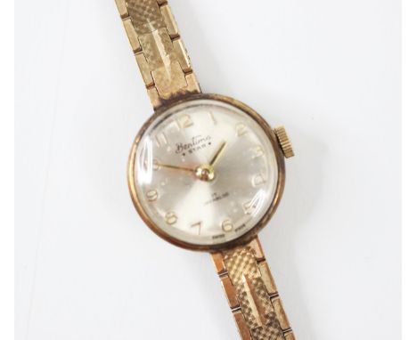 A 9ct yellow gold ladies 'Bentima Star' ladies wristwatch, the circular cream dial with Arabic numerals, set to a plain polis