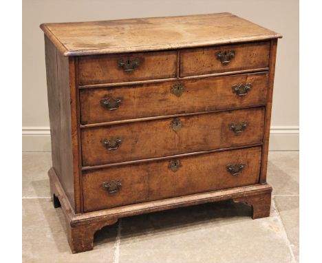 A William and Mary walnut chest of drawers, early 18th century, the rectangular moulded top over two short and three long cro
