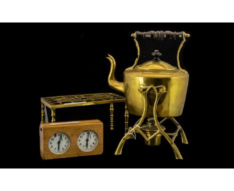 Antique Brass Tea Kettle on Stand with burner and a brass trivet with fret work top and a chess time clock.  