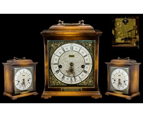 Westminster Mid Century German Mantle Clock on Six Bells - maker Kienzle. Brass mounts to one side of dial with carry handle.