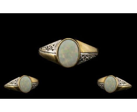 9ct Gold Attractive Single Stone Opal Dress Ring.  Fully hallmarked for 9.375.  The oval shaped opal of pleasing colours.  Ri